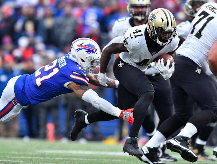 New Orleans Saints running back Alvin Kamara (41) runs past Buffalo Bills free safety Jordan Poyer (21) during the third quarter a game at New Era Field.